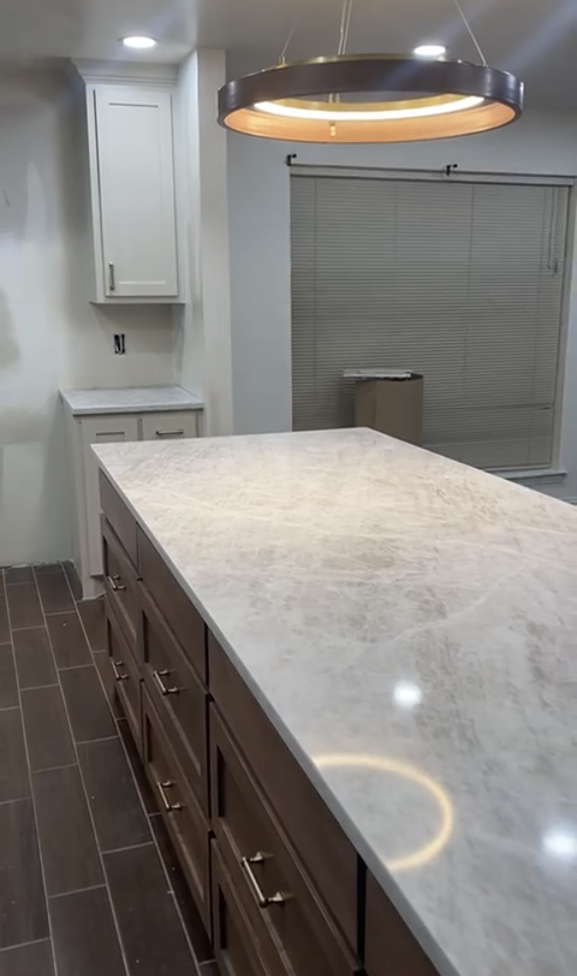 Kitchen island against dark cabinets